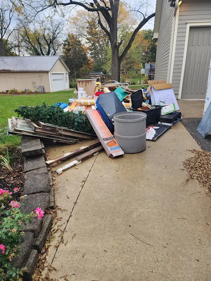 Dumpster being loaded with debris for 10 Yard Dumpster Rental in Cayuga Heights